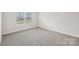 Bedroom with carpeted floors, natural light from the two windows, and neutral paint at 110 Obadiah Ct, Mooresville, NC 28115