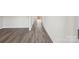 Hallway with wood-look flooring leads toward the door to the home's exterior at 110 Obadiah Ct, Mooresville, NC 28115