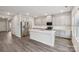 Modern kitchen featuring gray cabinets, stainless steel appliances, and a center island at 110 Obadiah Ct, Mooresville, NC 28115