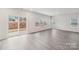 Bright living room with sliding glass doors and large windows, offering plenty of natural light at 110 Obadiah Ct, Mooresville, NC 28115