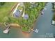 Expansive aerial view showcasing waterfront properties, private docks, and lush green landscapes along the shoreline at 112 Nautilus Ct, Troutman, NC 28166