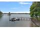 Stunning aerial shot of a lake featuring private docks and a tranquil shoreline, perfect for waterfront living at 112 Nautilus Ct, Troutman, NC 28166