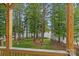 Scenic view from the deck overlooking the backyard, trees and lake at 112 Nautilus Ct, Troutman, NC 28166