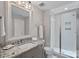 Bright bathroom featuring granite countertops, a frameless shower, and modern fixtures at 112 Nautilus Ct, Troutman, NC 28166