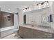 Bathroom featuring granite countertops, double sinks, grey cabinets, and decorative lights at 112 Nautilus Ct, Troutman, NC 28166