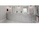 Bathroom with granite countertops, grey cabinets, double vanity, and modern fixtures at 112 Nautilus Ct, Troutman, NC 28166
