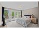 Bedroom with waterfront views, access to a private deck, and natural light at 112 Nautilus Ct, Troutman, NC 28166