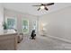 Bright and airy bonus room with a ceiling fan and a view of the outdoors at 112 Nautilus Ct, Troutman, NC 28166