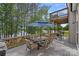Spacious deck with outdoor dining set and great view of the lake and surrounding trees at 112 Nautilus Ct, Troutman, NC 28166