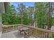 Inviting outdoor deck features a seating area with a beautiful view of the surrounding lake and trees at 112 Nautilus Ct, Troutman, NC 28166