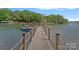 Well-maintained boat dock provides convenient access to the tranquil waterfront at 112 Nautilus Ct, Troutman, NC 28166