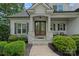 Charming front entrance features a double door, stone accents, and manicured landscaping at 112 Nautilus Ct, Troutman, NC 28166