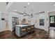 Modern kitchen featuring white cabinets, a center island with seating, and stainless steel appliances at 112 Nautilus Ct, Troutman, NC 28166