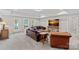 Spacious living room featuring cozy seating, a large TV, and access to the outdoors at 112 Nautilus Ct, Troutman, NC 28166