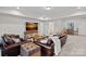 Bright living area featuring neutral paint, recessed lighting, and comfortable leather furniture at 112 Nautilus Ct, Troutman, NC 28166