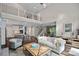 Open-concept living area with a high ceiling, staircase, and seamless flow to the kitchen at 112 Nautilus Ct, Troutman, NC 28166