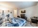 Comfortable bedroom featuring a plaid comforter, TV, and a cozy atmosphere, perfect for relaxation at 11515 Retriever Way, Charlotte, NC 28269