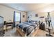 Comfortable bedroom with large window, lamp, neutral colored carpet, and desk at 11515 Retriever Way, Charlotte, NC 28269