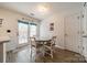 Dining area with a view of sliding doors opening to an outdoor space, and a door to the side at 11515 Retriever Way, Charlotte, NC 28269