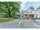 Inviting townhome with manicured landscaping, a charming front porch, and convenient parking, showcasing curb appeal at 11515 Retriever Way, Charlotte, NC 28269