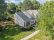 Charming two-story townhome with a well-maintained lawn, tasteful landscaping, and a welcoming front porch at 11515 Retriever Way, Charlotte, NC 28269