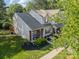 This home features a well-manicured lawn, brick accents and a tree providing shade and curb appeal at 11515 Retriever Way, Charlotte, NC 28269
