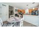 Eat-in kitchen featuring a pantry, adjacent to a staircase and a living area at 11515 Retriever Way, Charlotte, NC 28269