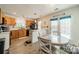 Eat-in kitchen featuring stainless steel appliances, wood cabinets, and plenty of natural light at 11515 Retriever Way, Charlotte, NC 28269