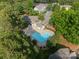 Aerial view of the community pool in a wooded setting, offering a refreshing amenity for residents at 11515 Retriever Way, Charlotte, NC 28269