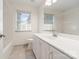 Bright bathroom with white cabinets, countertop, tub and tile flooring at 12013 Regent Ridge Ln, Charlotte, NC 28278
