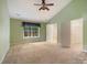 Large bedroom with an open closet and a window bringing in natural light at 12013 Regent Ridge Ln, Charlotte, NC 28278