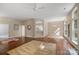 Open floor plan with hardwood floors, ceiling fan, and view of the dining area at 12013 Regent Ridge Ln, Charlotte, NC 28278