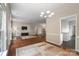 Spacious open-concept living room with hardwood floors and access to kitchen area at 12013 Regent Ridge Ln, Charlotte, NC 28278
