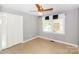 Bedroom with ceiling fan, double closet, and neutral walls offers comfort at 1211 Starlight Dr, Shelby, NC 28152