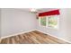 Bright bedroom with neutral gray walls and laminate flooring, flooded with natural light at 1211 Starlight Dr, Shelby, NC 28152