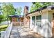 Wooden deck with white railings and string lights, offering a backyard view at 1211 Starlight Dr, Shelby, NC 28152