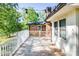 A well-maintained wooden deck with white railings and overhead string lights for evening ambiance at 1211 Starlight Dr, Shelby, NC 28152