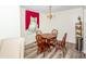 Dining room with chandelier, wood table and chairs offers an intimate setting at 1211 Starlight Dr, Shelby, NC 28152