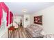 Cozy living room features wood floors, large sofa and traditional decor elements at 1211 Starlight Dr, Shelby, NC 28152