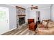 Living room features a stone fireplace, wood floors and neutral paint at 1211 Starlight Dr, Shelby, NC 28152