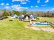 Expansive property with a pool, mature landscaping, and additional guest house at 12613 Oak Grove Rd, Stanfield, NC 28163
