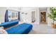 Bright bedroom featuring two twin beds, natural light, and adjacent bathroom access at 12613 Oak Grove Rd, Stanfield, NC 28163