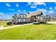 Beautiful house with a well-maintained lawn and an attached three-car garage at 12613 Oak Grove Rd, Stanfield, NC 28163