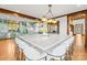 Spacious kitchen island with seating, offering a view into the dining area and stylish kitchen features at 12613 Oak Grove Rd, Stanfield, NC 28163