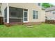 View of backyard featuring a screen door, vinyl siding, and small stairs leading down to the grass at 13032 Windy Lea Ln, Huntersville, NC 28078