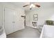 Bedroom featuring a white crib, white doors, and soft gray carpet flooring at 13032 Windy Lea Ln, Huntersville, NC 28078