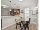 Cozy breakfast nook featuring a round table, black chairs, and natural light, ideal for casual dining at 13032 Windy Lea Ln, Huntersville, NC 28078