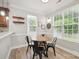 Bright breakfast nook with abundant natural light, a charming breakfast table, and views of the outdoors at 13032 Windy Lea Ln, Huntersville, NC 28078