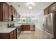 Spacious kitchen with stainless steel appliances, wood cabinets, and an open design at 13032 Windy Lea Ln, Huntersville, NC 28078