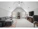 Spacious living room features a ceiling fan, recessed lighting, and neutral gray walls with a large comfortable gray couch at 13032 Windy Lea Ln, Huntersville, NC 28078
